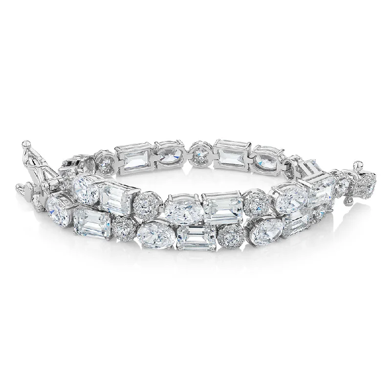 Grab Exquisite Jewelry At The Lowest Prices Emerald Cut, Oval and Round Brilliant tennis bracelet with 21.98 carats* of diamond simulants in sterling silver