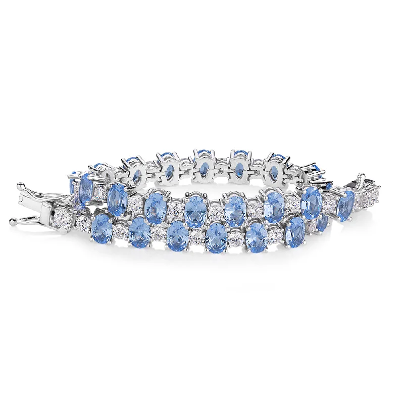 Luxury Jewelry At Unbeatable Discounts Oval and Round Brilliant tennis bracelet with blue topaz simulants and 3.26 carats* of diamond simulants in sterling silver Luxury Jewelry At Unbeatable Discounts Oval and Round Brilliant tennis bracelet with blue topaz simulants and 3.26 carats* of diamond simulants in sterling silver