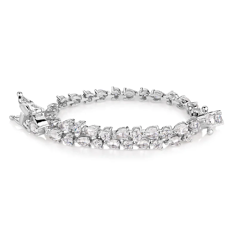 Grab Your Dream Jewelry At The Lowest Prices Pear and Round Brilliant tennis bracelet with 6.40 carats* of diamond simulants in sterling silver