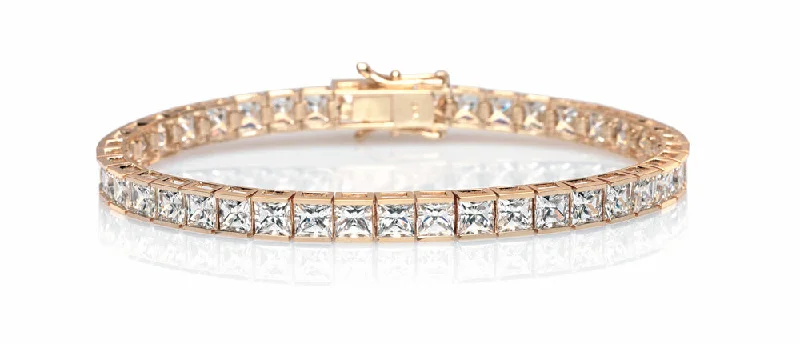 Premium Diamond Jewelry For Unforgettable Moments Princess Cut tennis bracelet with 18.72 carats* of diamond simulants in 10 carat yellow gold