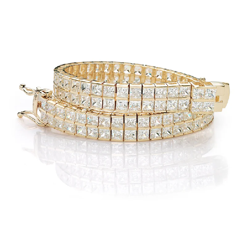 Breathtaking Jewelry, Breathtaking Prices Princess Cut tennis bracelet with 22.68 carats* of diamond simulants in 10 carat yellow gold