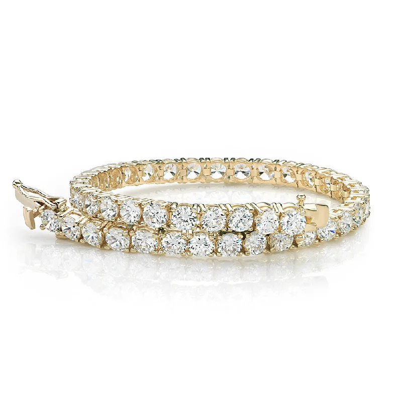 Your Perfect Accessory Now At The Best Price Round Brilliant tennis bracelet with 11 carats* of diamond simulants in 10 carat yellow gold