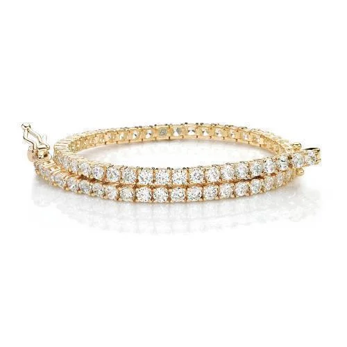 Shop Jewelry That Shines Without The High Price Round Brilliant tennis bracelet with 4.38 carats* of diamond simulants in 10 carat yellow gold Shop Jewelry That Shines Without The High Price Round Brilliant tennis bracelet with 4.38 carats* of diamond simulants in 10 carat yellow gold
