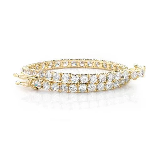 Elegant Jewelry, Exclusive Prices – Shop Now Round Brilliant tennis bracelet with 9.52 carats* of diamond simulants in 10 carat yellow gold Elegant Jewelry, Exclusive Prices – Shop Now Round Brilliant tennis bracelet with 9.52 carats* of diamond simulants in 10 carat yellow gold