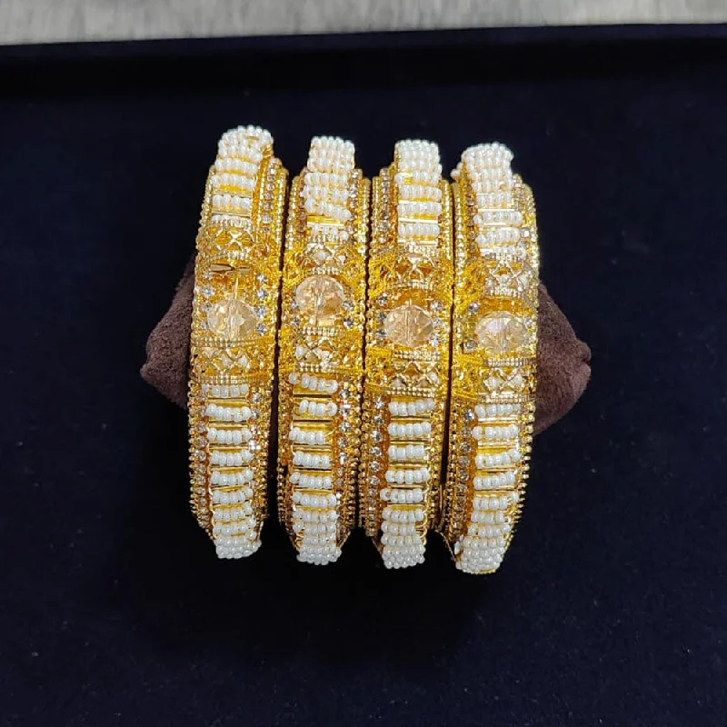 Fashion-Forward Jewelry At Exclusive Discounts Pooja Bangles Gold Plated Austrian Stone Pearls Bangles Set Fashion-Forward Jewelry At Exclusive Discounts Pooja Bangles Gold Plated Austrian Stone Pearls Bangles Set